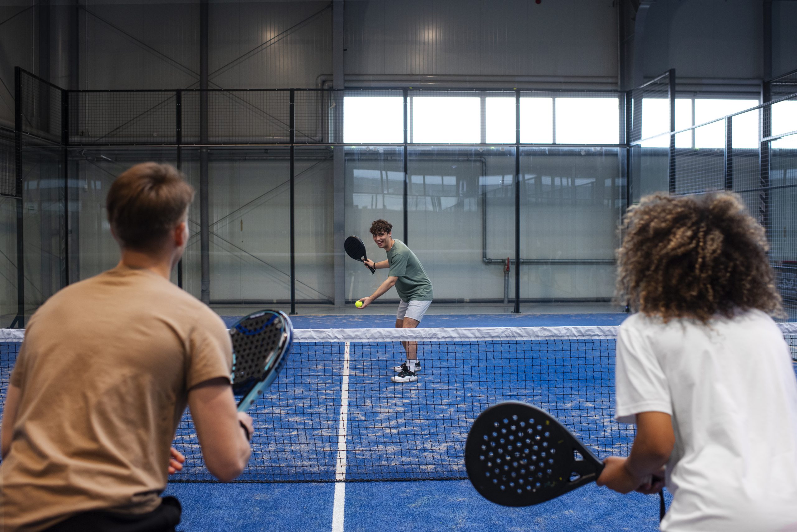 people playing padle tennis inside